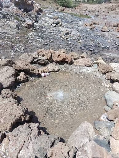 Steaming geothermal pools in the semi-arid Nyatike landscape