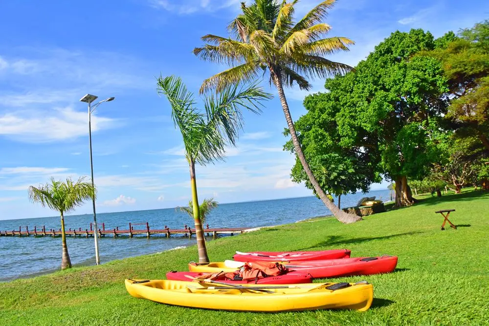 Wooden canoe on a quiet white-sand beach on Rusinga Island
